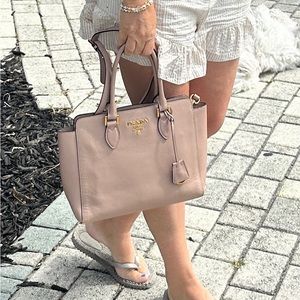 Authentic crossbody and double handle tote from Prada in a pinkish beige.